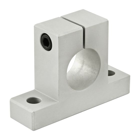 side view of a stanchion base that has a thick rectangular bottom portion with a mounting hole on each side and a square piece extending out from the center that has a hole in the middle