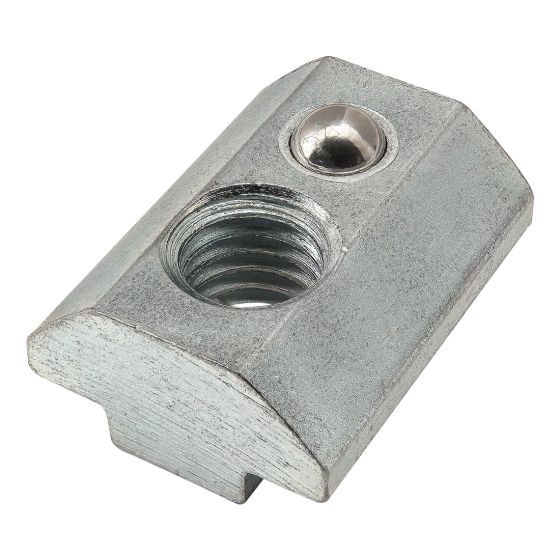 top view of a t-nut with a flat bottom ridge, angled sides, and a flat top with a threaded hole on one end and a metal ball set into a hole on the other end