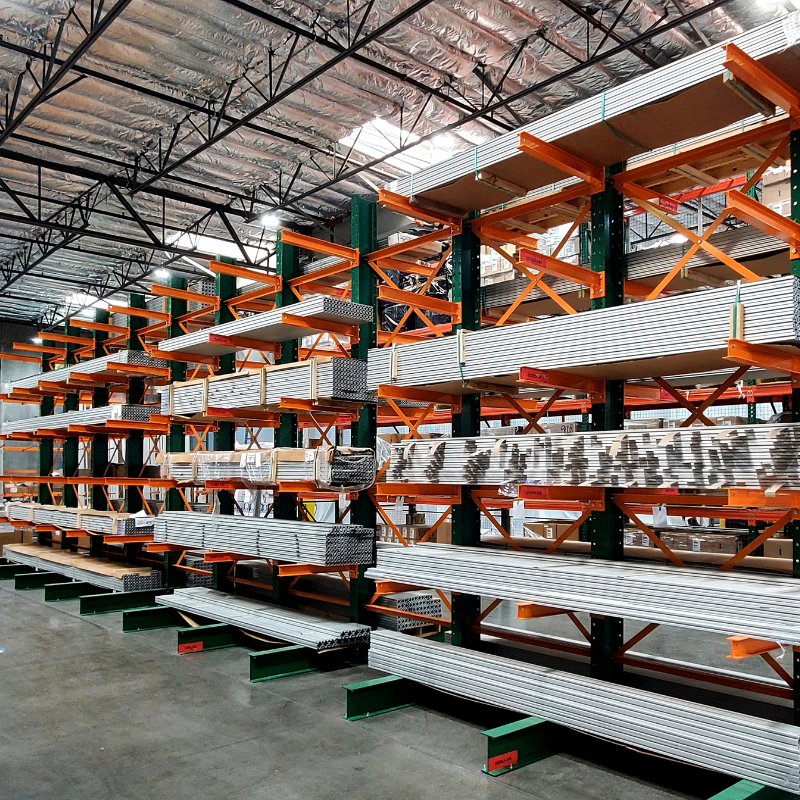 Green and orange shelving with metal organized on the shelves 