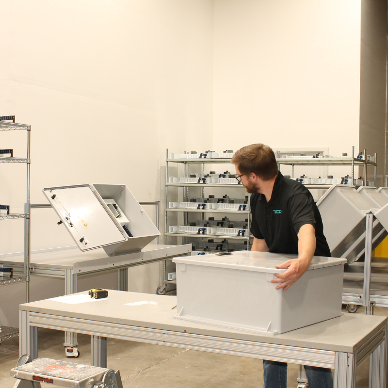Employee moving a box in the shop