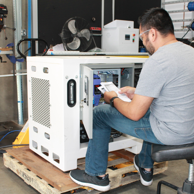 Man reading manual for a system in front of him