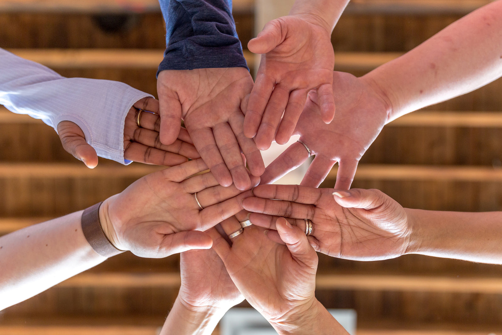 Employee hands gathered together 
