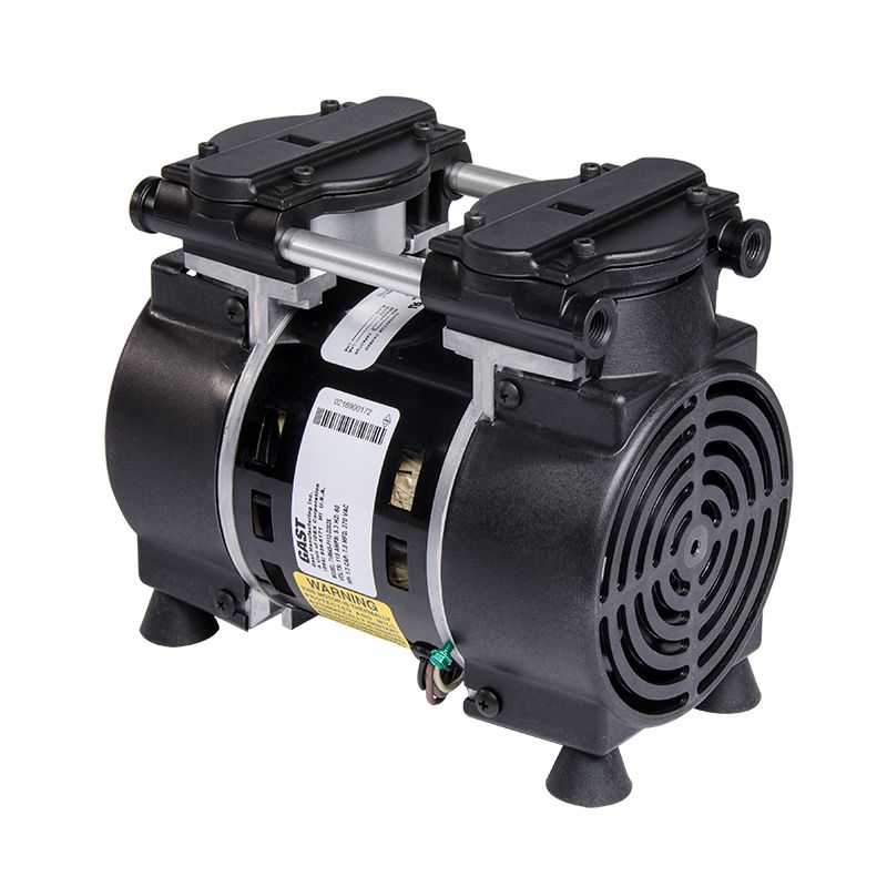 Cylinder shaped compressor with twin heads held together with 2 twin rods. 4 rubber feet for noise and vibration reduction.