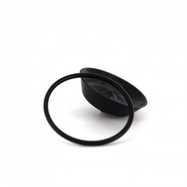 round black rubber seal sitting next to a round black cover