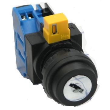 top front view of a black key switch with a blue block at the back, a yellow tab on the top and a metal key hole at the front