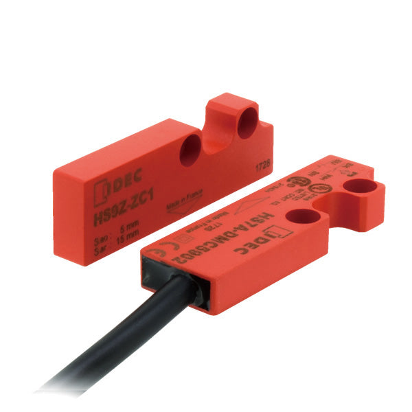 top side view of two red rectangular safety switches, with two holes at the back end of each and a black cable connected to one switch on the bottom left
