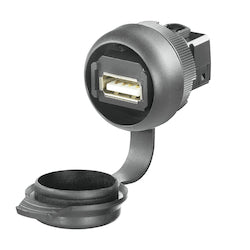 USB port in the center of a grey circular housing with an opened cap attached