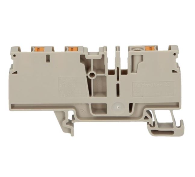 side view of a beige feed-through terminal with two grooves in the top center and rail mounting at the bottom