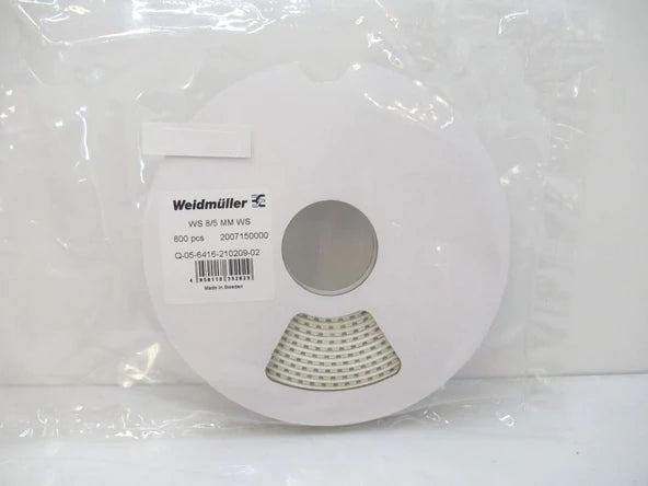 white disc with white marking tape rolled around it