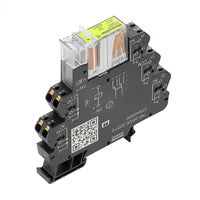 top side view of a black relay module with tiered connection points on each side