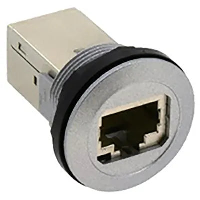 front side view of a metallic buzzer, a rectangular metal body in the back and a circular metal piece in the front with an input port in the center