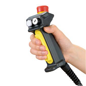 side view of a hand gripping a black and yellow handle with switches and a red button on top