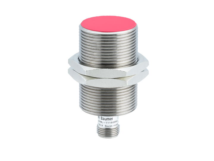 nickel plated tubular shaped  switch with threading all the way around, a smaller threaded stem at the bottom, and a red button on the top