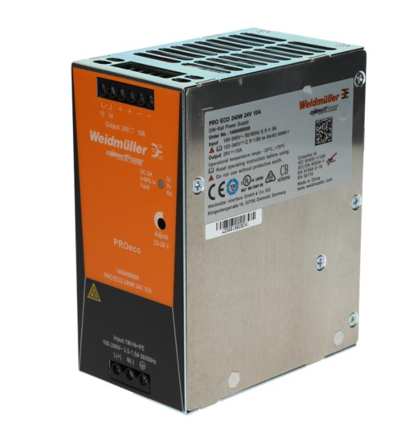 side view of an upright rectangular power supply unit with input ports on the bottom of the left side panel, an orange label on the top of the left side panel, a white label on the top of the right side panel, and a vent on the top panel